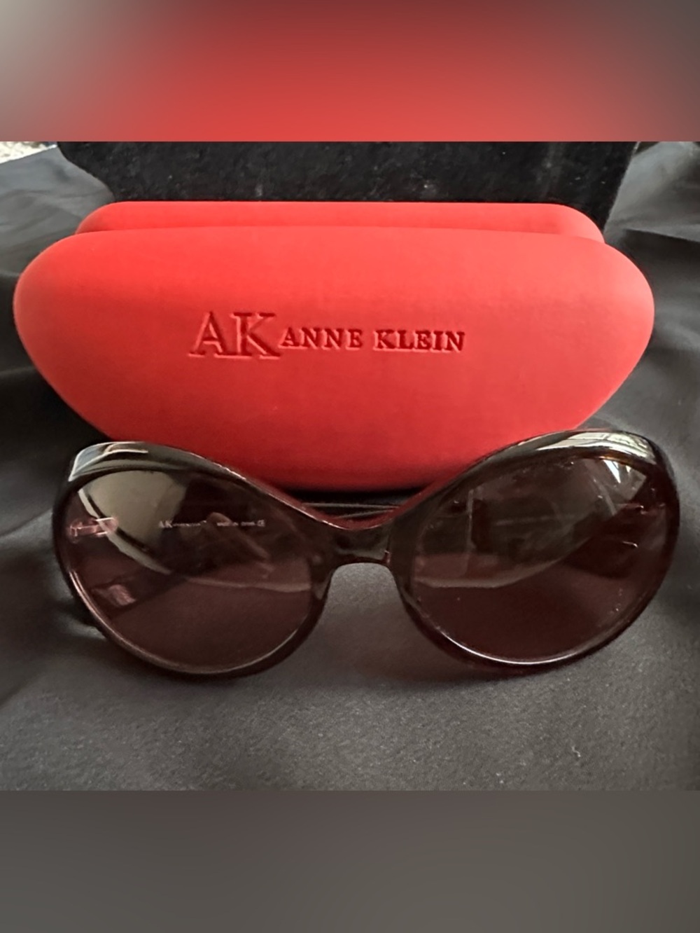 Anne Klein EUC sunglasses. Dark tortoise frames & plum color lenses w/ case